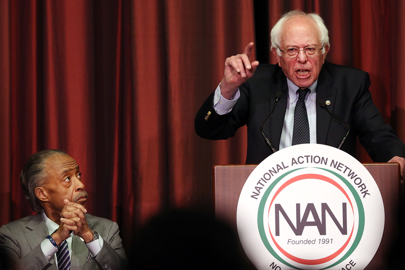 Democratic presidential candidate Sen. Bernie Sanders speaks beside Rev. Al Sharpton during the 25th annual National Action Network convention on April 14, 2016 in New York City.